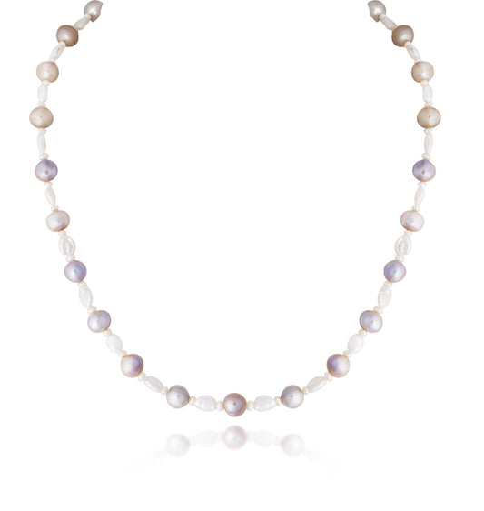 A STRAND OF CULTURED SOUTH SEA PEARL WIH UNHAPE PEARL