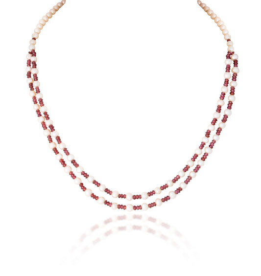 A STRAND OF INDIAN RUBY & CULTURED PEARL