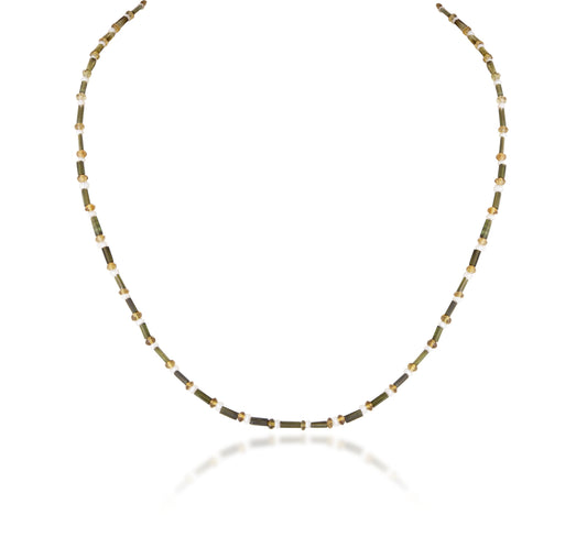 A STRAND OF TURMLINE CUSTOM CUT WITH PEARL