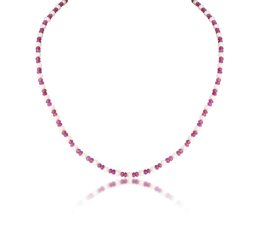 A SINGLE LINE STRAND OF RUBY WITH CULTURED PEARL