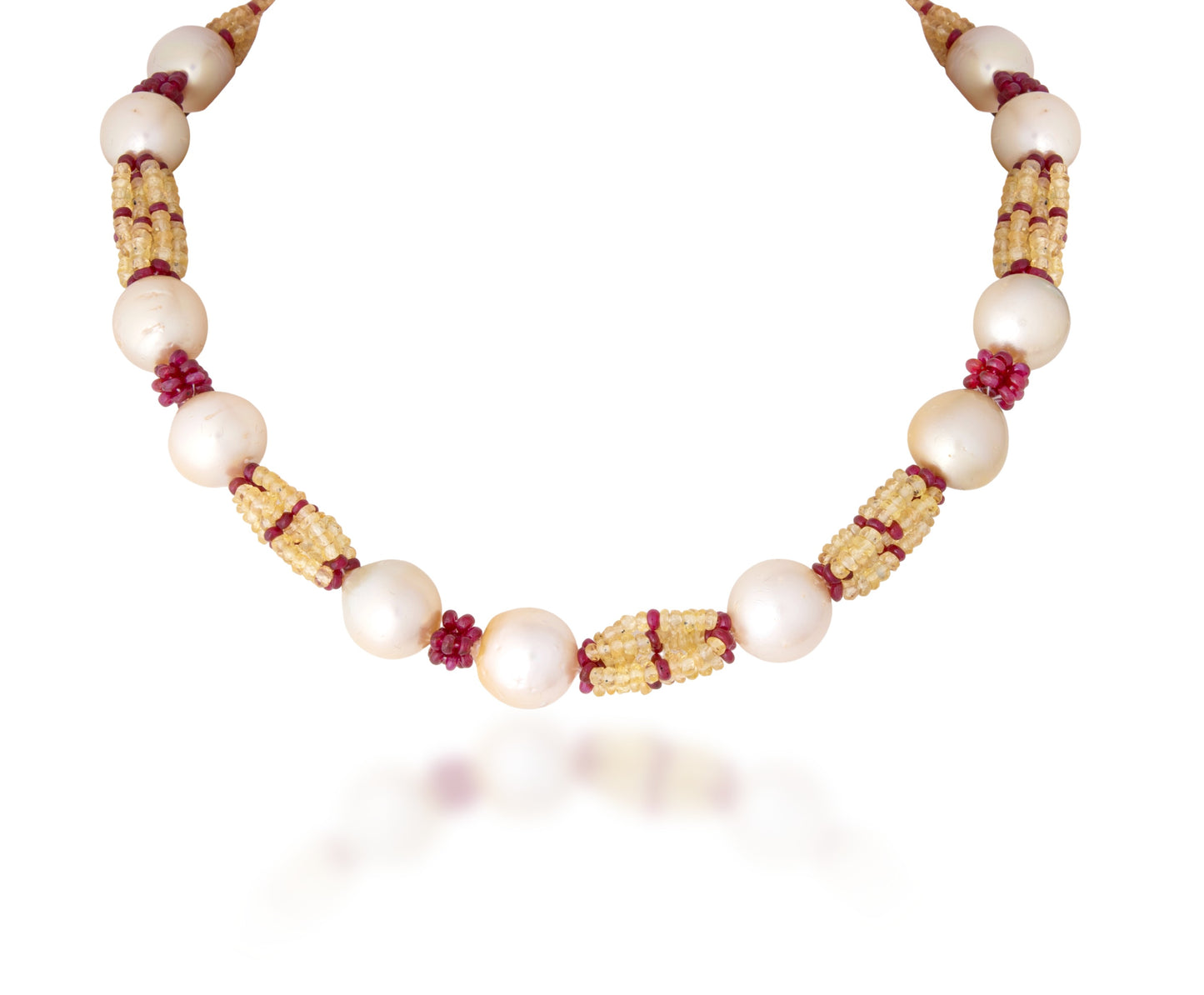 A STRAND OF SOUTH SEA RUBY & YELLOW SAPPHIRE