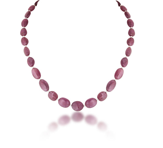 A STRAND OF TURMALIN CUSTOM CUT WITH PEARL